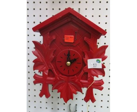 * German red cased small cuckoo clock with weight driven movement 