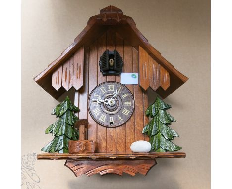 * A ''rustical walnut'' finished quartz cuckoo clock. (Photograph for Illustration Purposes only)