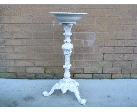 Cast iron tripod bird bath on moulded support. 74cm high
