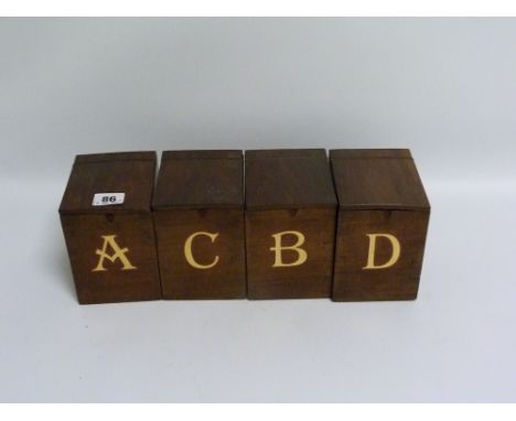 Four 19th century mahogany tea caddy boxes of rectangular form with hinged lids, labelled A.B.C. &amp; D., each 13cm high, 12