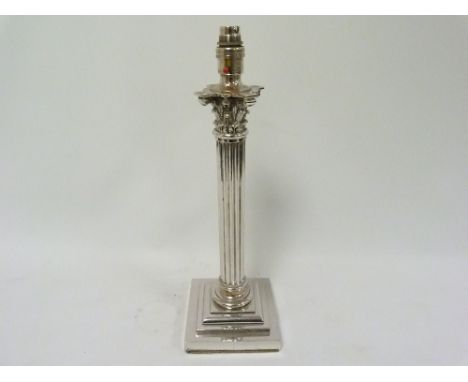 Large e.p. table lamp in the form of a fluted column on stepped base.