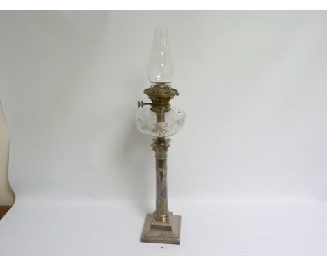 E.p. oil lamp with cut glass reservoir upon column part fluted &amp; swagged, upon square base, c.1900.