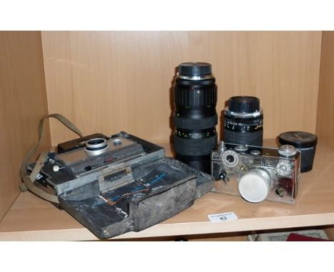 A vintage Argus C3 "The Brick" 35mm camera (A/F), a Polaroid 101 land camera, three lenses and another camera