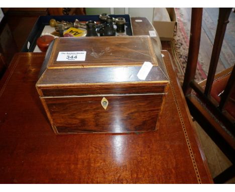 Victorian rosewood and inlaid tea caddy of two sections and having ring handles