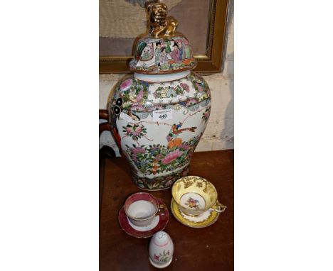 Chinese porcelain vase with cover, teacups and saucers