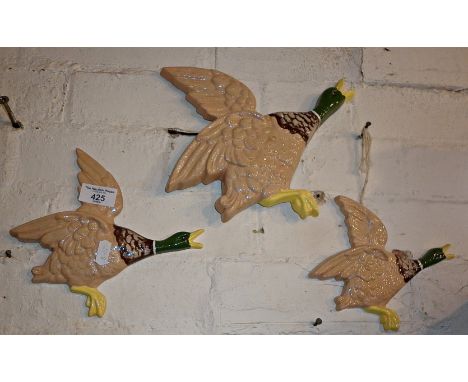 Three ceramic wall hanging flying ducks