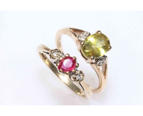 Two 9 carat gold rings, ruby and diamond, and peridot.