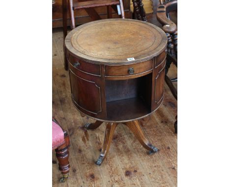 Mahogany revolving drum book table, 70cm high by 51cm diameter.