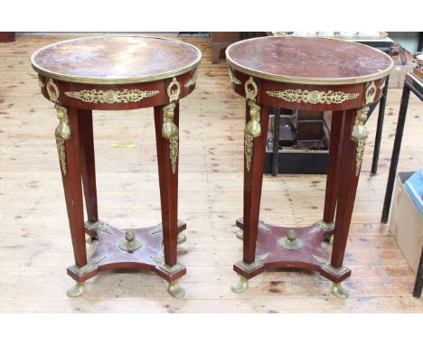 Pair Empire style walnut and brass mounted circular side/lamp tables, 90cm high by 60cm diameter.