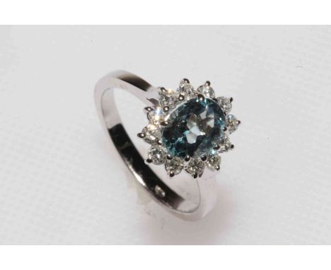 18 carat white gold aquamarine and diamond ring, having approximately 1 carat oval aquamarine bordered with twelve brilliant 