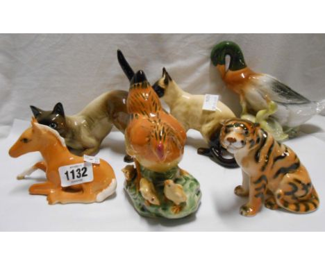 Six ceramic animal figurines including Beswick pony, ducks, cats, etc.