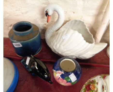 A Dartmouth Pottery swan planter (a/f) - sold with a Poole Pottery dolphin figurine and two pottery vases