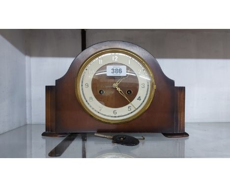 A vintage mahogany cased mantel clock with Smiths Enfield eight day gong striking movement