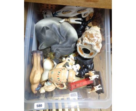 A crate containing a quantity of resin, ceramic and other figurines including cats, etc.