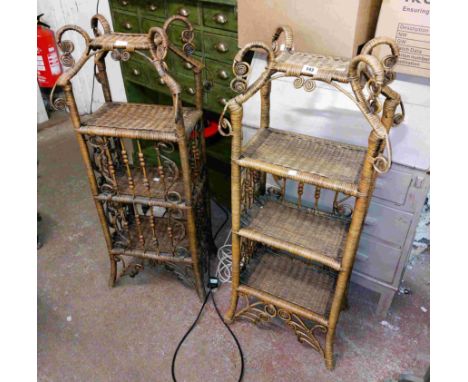 A pair of 40cm cane bound three shelf open bookcases with decorative scroll tops and bases