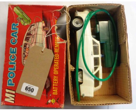 A vintage Louis Marx M1 Police car remote control vehicle - box a/f