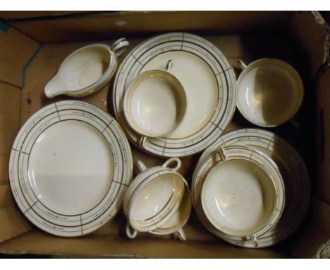 A crate containing a quantity of Clarice Cliff tableware including soup bowls, plates, etc.