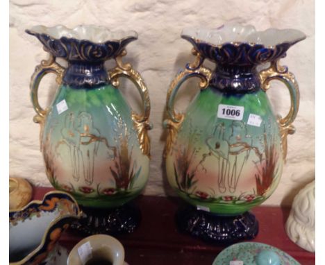 A pair of large Edwardian ceramic vases with gilt tube-lined lovebird decoration