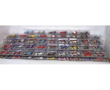 A collection of Panini 1:43 scale F1 race cars - sold with related folders and info sheets - Nos.1 to 126 (missing 14 and 22)