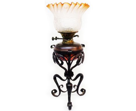 A late 19th Century oil lamp with Arts &amp; Crafts Movement wrought iron copper reservoir with Messingers Patent Duplex twin