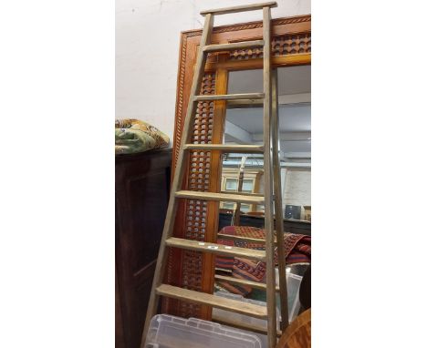 A 2.16m vintage French pine fruit ladder with eight graduated treads