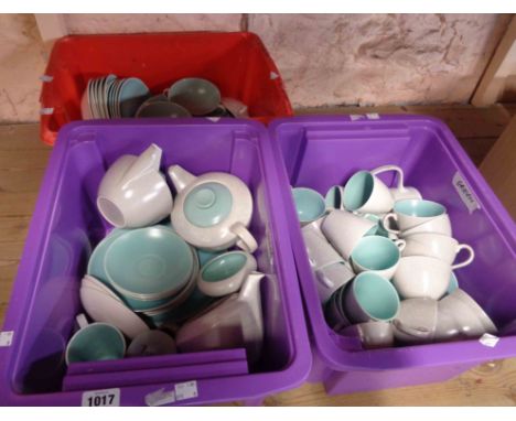 Three crates containing a quantity of vintage Poole Pottery tableware in the Pebble and Ice Green colourway including teapots