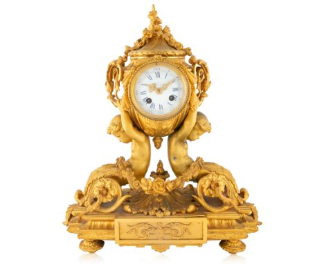 A LOUIS XVI STYLE ORMOLU CLOCK, 19TH CENTURY an urn shaped body, with foliate scrolls shaped as handles, the cover features a