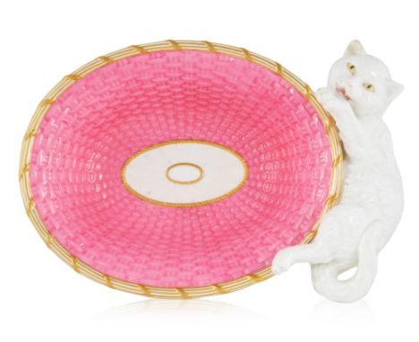A BRITISH PORCELAIN 'WHITE CAT' VIDE POCHE, BROWNFIELD, STOKE-ON-TRENT, 1860-1876oval, playfully modelled as a pink wicker ba