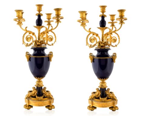 A PAIR OF FRENCH ORMOLU-MOUNTED PORCELAIN CANDELABRA, LATE 19TH-EARLY 20TH CENTURY of urn form, five light candelabras with a