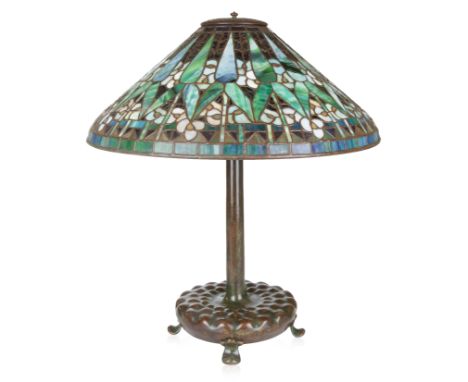 A MODERN 'MORNING GLORY' TABLE LAMP, MANNER OF TIFFANY STUDIOSstained glass and bronze, the base with ribbed design on ball f