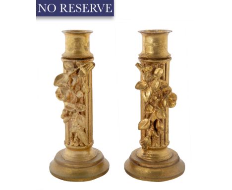 PAIR OF GILT CANDLESTICKS, EARLY 20TH CENTURY fluted stem and rounded ribbed sconce in gilt, the recto features a rose branch