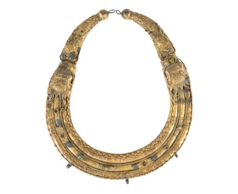 A TIBETAN BRASS CIRCULAR CEREMONIAL COLLAR, MODERN of circular form, two dragons form the circle, the circle can articulate m