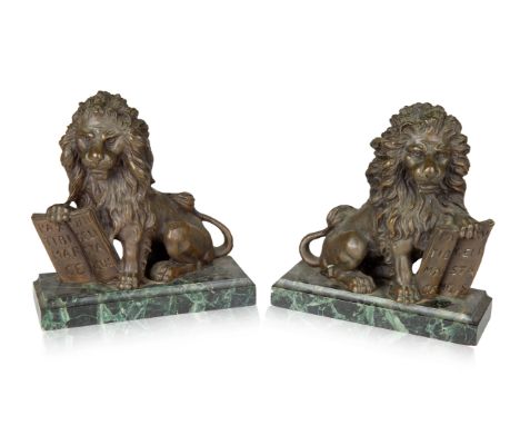 A PAIR OF FRENCH LION BRONZE AND GREEN MARBLE BOOKENDS, LATE 19TH CENTURY the bronze formed as upright lions, each with a paw