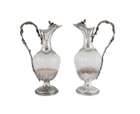 A PAIR OF ITALIAN SILVER AND GLASS PITCHERS, ASCANIO, EARLY 20TH CENTURY of squated baluster form with a tapered neck and bas