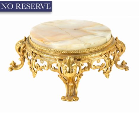 A FRENCH ONYX ORMOLU TABLE PLANT STAND, CIRCA 19TH CENTURY of rounded squated form, rose onyx with endemic faults and cracks 