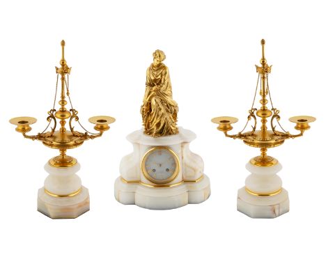 AN ORMOLU-MOUNTED WHITE MARBLE MANTLE CLOCK AND PAIR OF CANDLESTICK GARNITURES, CIRCA 1970the pair of candlestick garnitures 