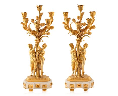 A PAIR OF FRENCH LOUIS XV STYLE CANDELABRAS, 19TH CENTURY a pair of a six-light gilt candelabras, each with a pair of barefoo