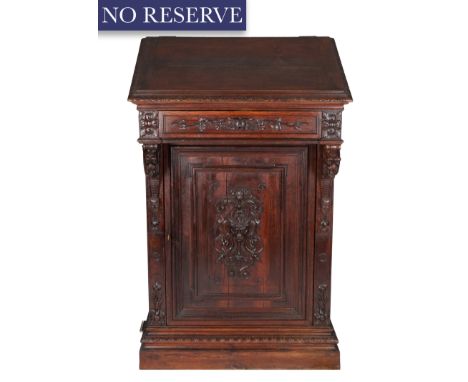 A FRENCH-RENAISSANCE MONUMENTAL CARVED-OAK CABINET, 19TH CENTURY of tapered rectangular form, slanted top that opens up to an