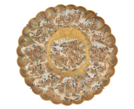A DECORATIVE JAPANESE EARTHENWARE DISH, GETSATSUZAN, DAI NIPPON, SATSUMA YAKI, MEIJI PERIOD (1868-1912) of circular form with