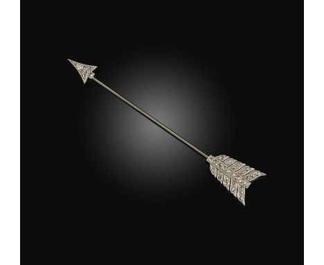 An early 20th century diamond jabot pin, the stylised arrow set with rose-cut diamonds in platinum and gold, length 8.4cm, ca