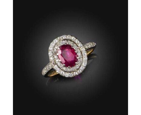 A ruby and diamond ring, of cluster design, claw-set with an oval ruby weighing approximately 1.00 carat, to a double border 
