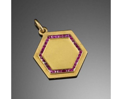 Lacloche Frères, an Art Deco gold and ruby pendant, 1920s, of hexagonal outline in gold, the central panel outlined in calibr