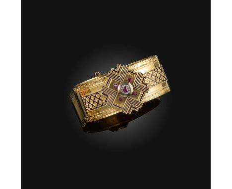 A French late 19th century gold bangle, decorated with rubies, diamonds and black enamel in geometric design in 18ct yellow g