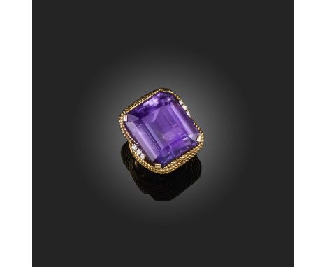 An amethyst and diamond cocktail ring, France, third quarter 20th century claw-set with a large step-cut amethyst weighing ap