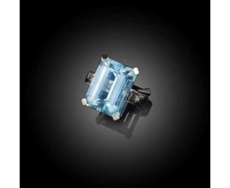 An aquamarine ring, claw-set with a step-cut aquamarine weighing approximately 11.00 carats, to a plain platinum shank, size 