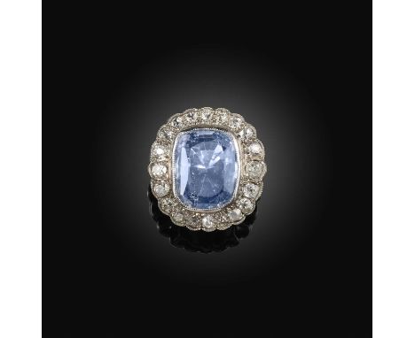 A sapphire and diamond ring, collet-set with a rectangular cushion-shaped diamond weighing approximately 10.00 carats, within
