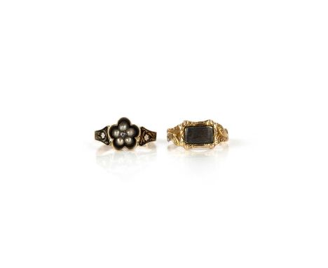 Two mourning rings, 19th century, comprising: one ring centring on a cluster of half seed pearls and a cushion-shaped diamond