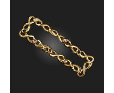 A Victorian gold, ruby and diamond bracelet, mid 19th century, composed of gold links designed as snakes, their heads alterna