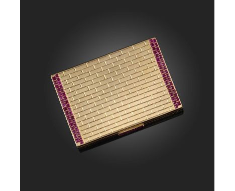 A gold and synthetic ruby cigarette case, mid 20th century, the exterior engraved with brick motifs, the push piece and lid s