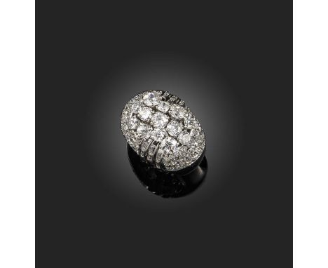 A diamond cocktail ring, France, mid 20th century, of bombé design, centring on a cluster of circular-cut diamonds, to a moun